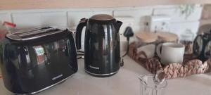 a black appliance sitting on top of a kitchen counter at African Sands B&B in Amanzimtoti