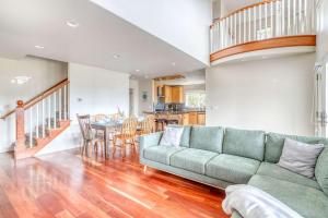 a living room with a couch and a table at Twin Rocks Beach House in Rockaway Beach