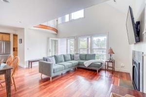 a living room with a couch and a table at Twin Rocks Beach House in Rockaway Beach +36 photos