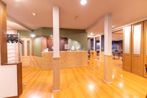 a large room with a bar in the middle of it at 灯ノ環tomonowa in Mitsuwa +127 photos
