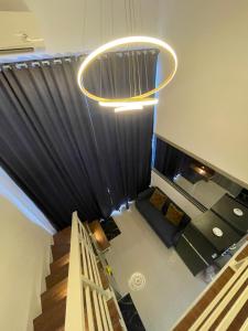 an overhead view of a living room with a chandelier at Deed Apartemen in Gresik