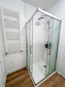 a shower with a glass enclosure in a bathroom at Zen & uS Maison entière in Margny-lès-Compiègne +19 photos