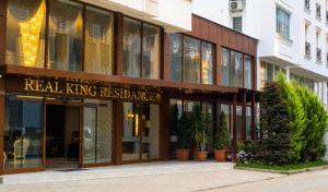 a building with a real king residence on a street at REAL KiNG RESiDENCE in Trabzon