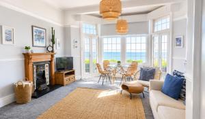 a living room with a couch and a table at A View Of The Bay- Close to Margate - Sleeps 3 in Westgate-on-Sea