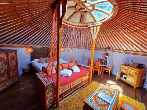 an overhead view of a bedroom in a yurt at Domaine Arvor & Spa in Lanvallay