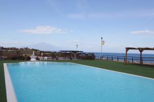 Swimmingpoolen hos eller tæt på Hotel Capo Campolato