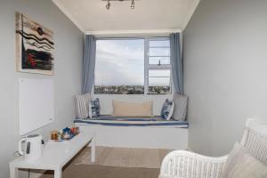 a window seat in a room with a large window at Alfred View in Port Alfred