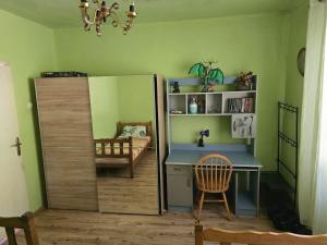 a room with a desk and a book shelf at Lina in Dobrota