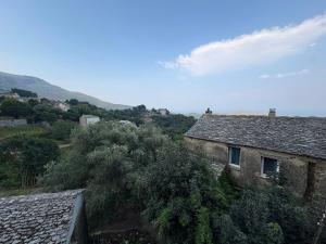 a view of a house with a mountain in the background at A Casuccia Sischese in Sisco