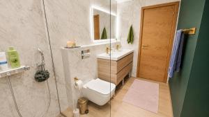 a bathroom with a shower and a toilet and a sink at Kaasaegne puhkemaja in Kersalu +13 photos