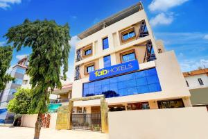 a building with the ibid hotels sign on it at FabHotel Saanvi Paradise in Bhopal