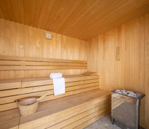 a wooden sauna with a trash can in it at Aminess Alfir Hotel in Blato