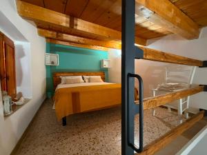 a bedroom with a bed and a blue wall at Ai Sette Scalini in Larino