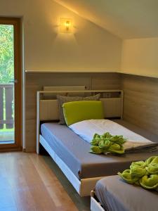 a bedroom with two beds in a room at Apartment Bodnerhof in Nova Ponente