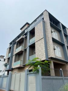 an apartment building with a blue at Kaizen Living in Guwahati