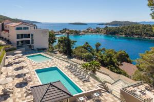 an aerial view of a resort with a swimming pool at Aminess Alfir Hotel in Blato