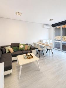 a living room with a couch and a table at RTS Residence in Baia Mare