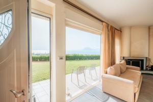 a living room with a couch and a fireplace at Boomerang Villa in Patra