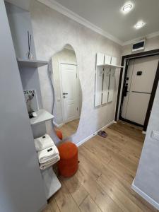 a room with a mirror on the wall at Апартаменты в центре in Balqash