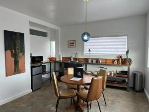 a kitchen with a table and chairs in a room at Pik Pak in Marfa +30 photos