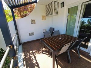 a table and chairs on the balcony of a house at Agava in Lovište