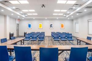 a room with tables and chairs in a classroom at Holiday Inn Express and Suites Saint Augustine North by IHG in St. Augustine +65 photos