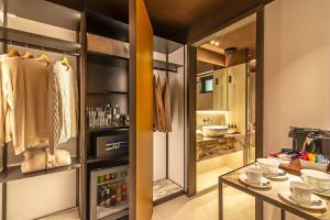 a kitchen with a refrigerator and a table at Domus Teatro di Pompeo in Rome