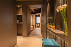 a hallway with a blue bench in a room at Domus Teatro di Pompeo in Rome +52 photos