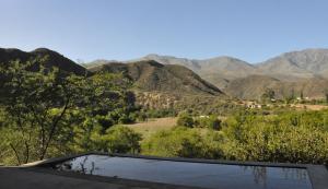 a view of the mountains from the roof of a house at Schuilhoek Cottage - Your perfect hide away! in Calitzdorp