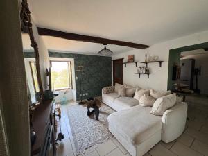 a living room with a couch and a table at A Casuccia Sischese in Sisco