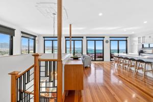 an open kitchen and dining room with a dining table at Marram House - Views in Marengo in Marengo