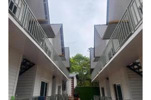 two buildings with balconies on the sides of them at FabHotel Hill View Cottages in Arpora