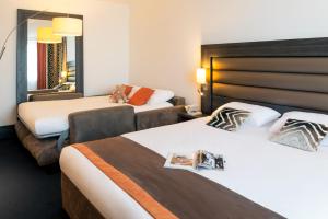 Postel nebo postele na pokoji v ubytování Mercure Lyon Centre - Gare Part Dieu