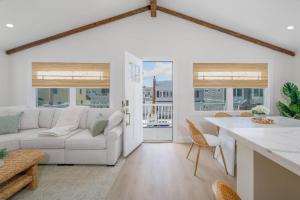 a living room with a couch and a table at Mermaid Lane #2 in Brighton Beach