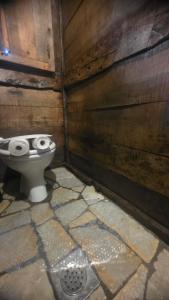a bathroom with a toilet with a face drawn on it at Brvnara Jez in Kraljevo