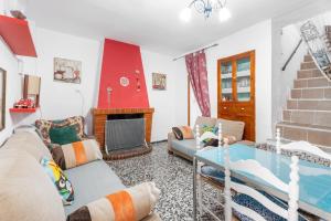 a living room with a couch and a fireplace at Casa Ratón Pérez in Navarrés