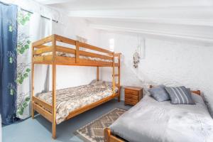 a bedroom with two bunk beds and a bed at Casa Ratón Pérez in Navarrés