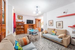 a living room with a couch and a table at Casa Ratón Pérez in Navarrés