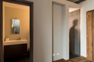 a bathroom with a sink and a mirror at Bhavantu in Boario Terme +45 photos