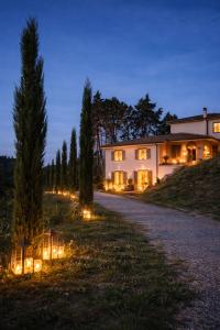 a house with lights on the side of a road at Tenuta di Monte Gemini in Campagnano di Roma