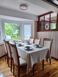 a dining room with a table and chairs at Przystanek Kaszuby in Kamień