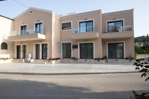 a villa with a large driveway in front of it at Glamour Residences 3-4 by CorfuEscapes in Análipsis