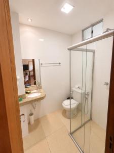 a bathroom with a toilet and a sink at CAMBRAIA HOTEL ARCOS in Arcos +38 photos