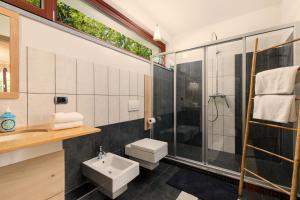 a bathroom with a sink toilet and a shower at Ca'Luna Guest House in Mondovì +67 photos