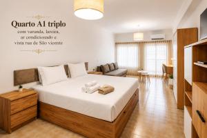 a bedroom with a large bed in a room at Rooms4you 1 in historic center of Braga in Braga