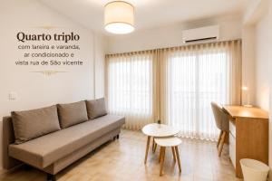 a living room with a couch and a table at Rooms4you 1 in historic center of Braga in Braga