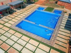 an overhead view of a blue swimming pool at Matsamo Lakeview Lodge in Schoemansdal