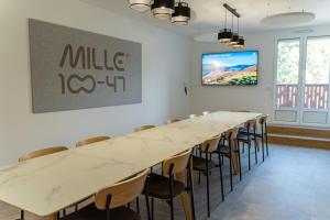 a large conference room with a long table and chairs at Mille100-47 - Ubaye Base Camp in Faucon-de-Barcelonnette