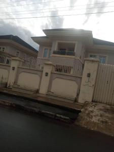 a white house with a fence in front of it at 5-bedroom fully detached duplex in Enugu