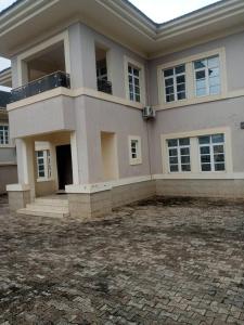 a large white house with a driveway in front of it at 5-bedroom fully detached duplex in Enugu